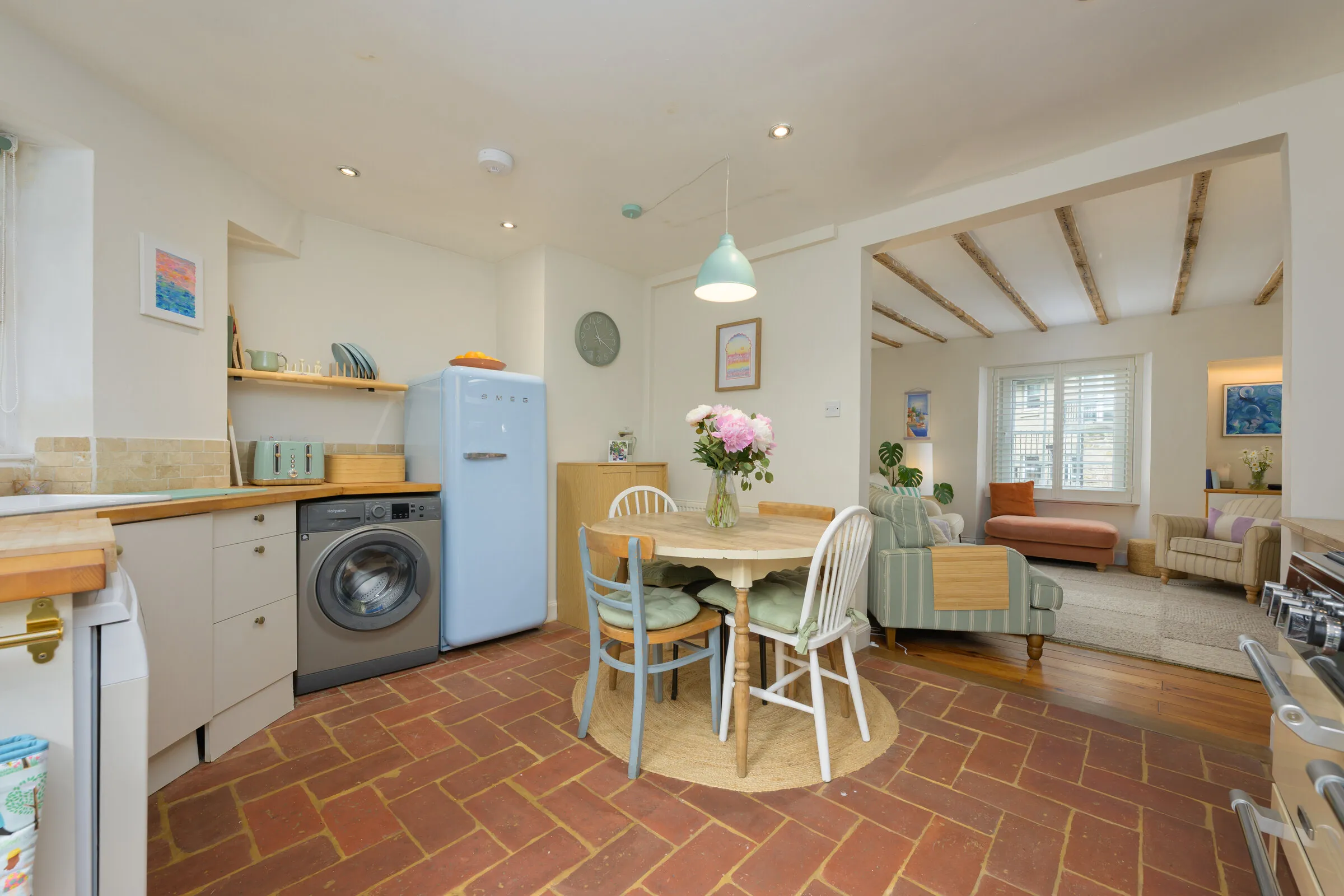 The open-plan kitchen and dining area at Brewlands Cottage