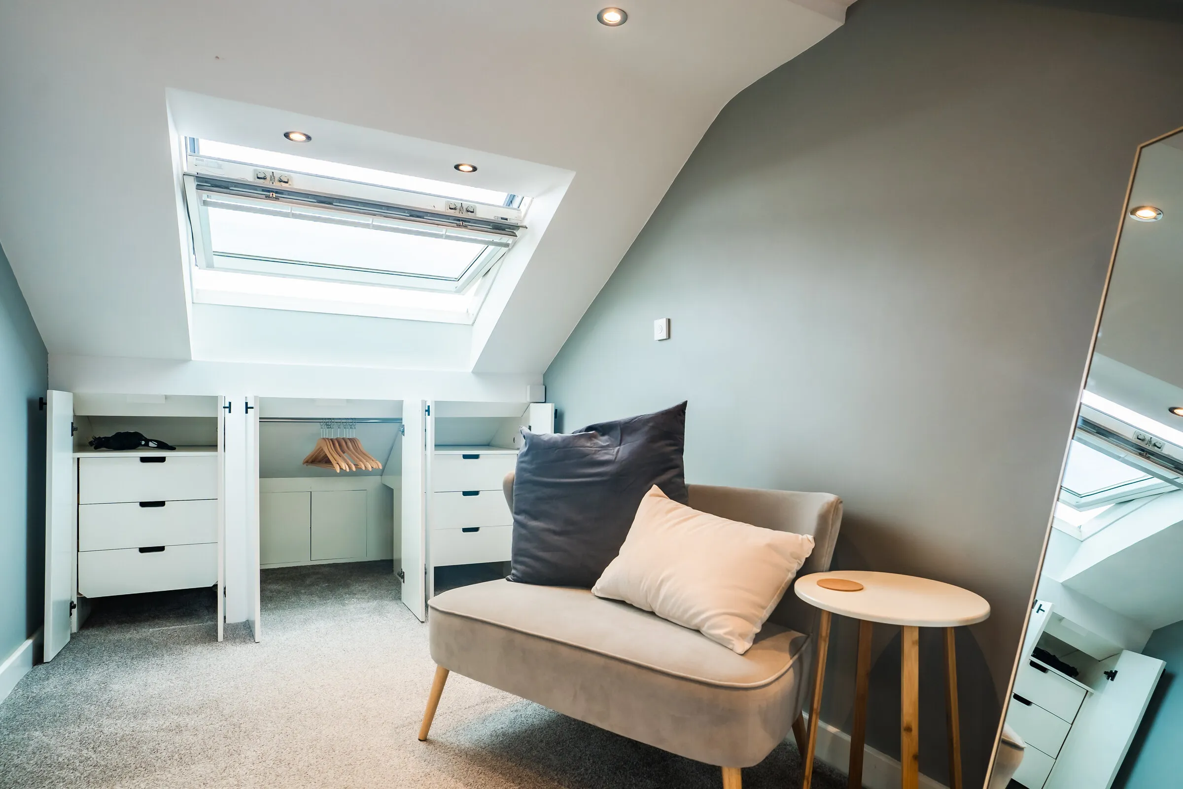 The loft bedroom's skylight and storage at Paton Street Stay